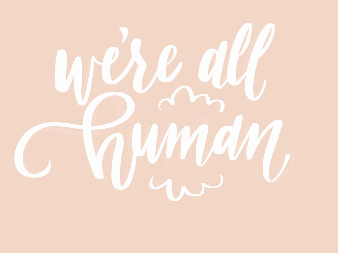 we're all human in white brush script on blush